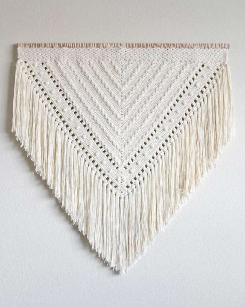 white triangular wall hanging