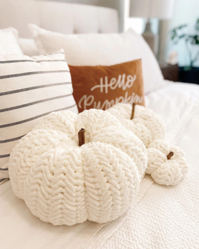 three white, thick and soft pumpkins of varying sizes