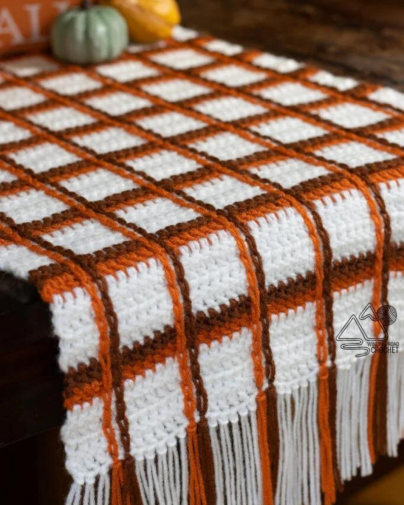 orange, brown, and white gingham table runner