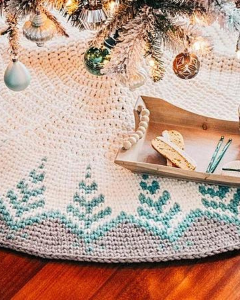 white, blue, and grey crochet christmas tree skirts with trees on it