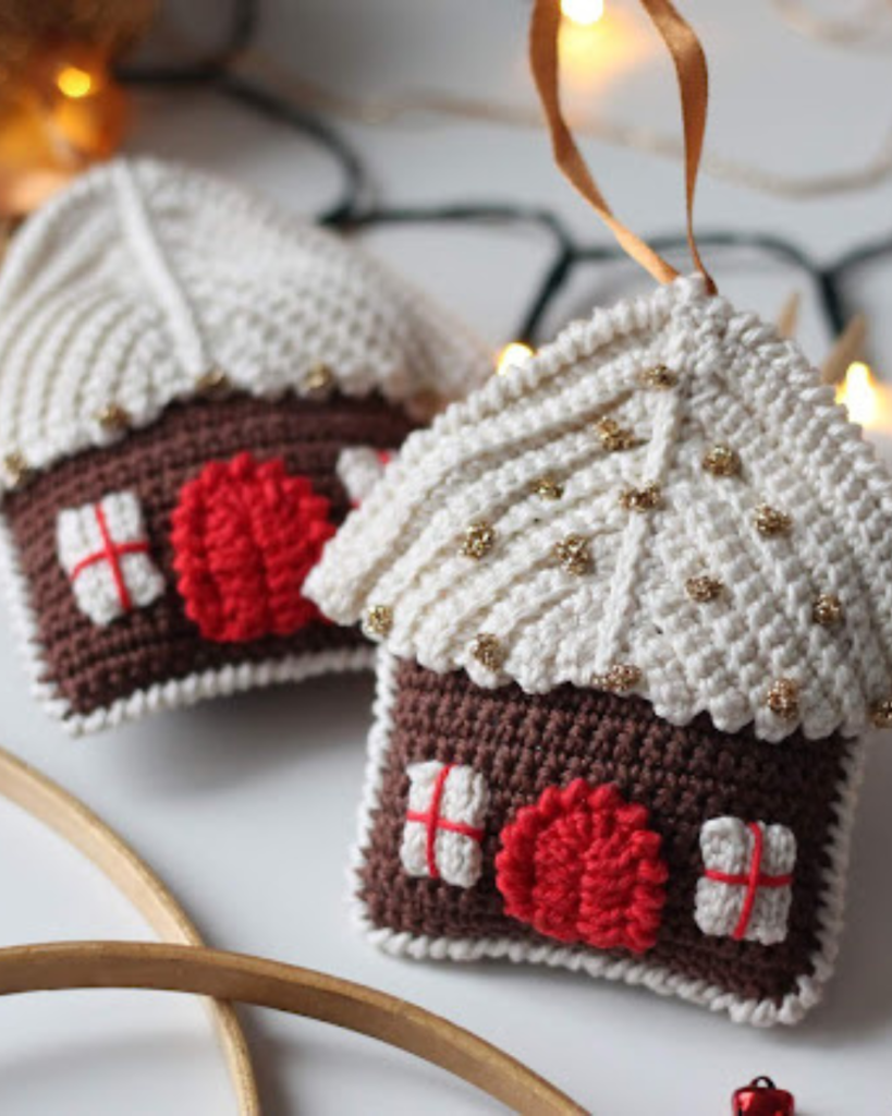 two crochet amigurumi gingerbread house ornaments