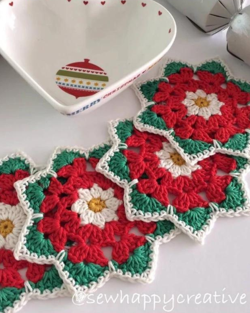 crochet red, green, and white poinsettia flower coasters