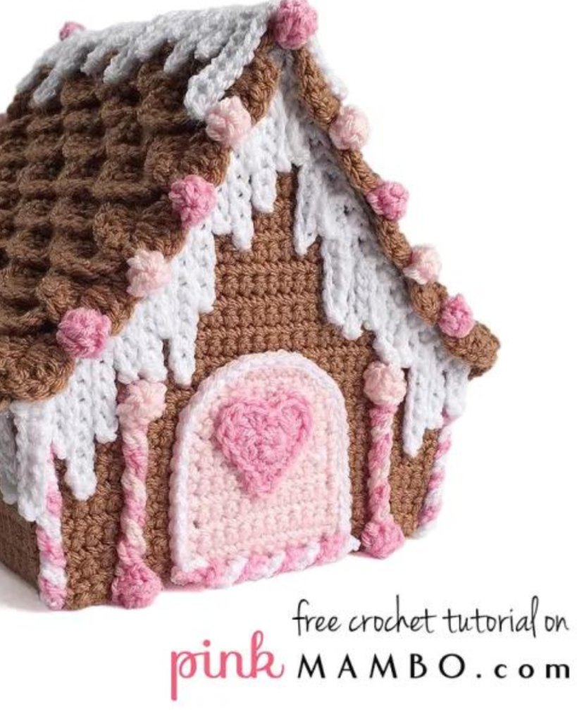 crochet pink, brown, and white gingerbread house