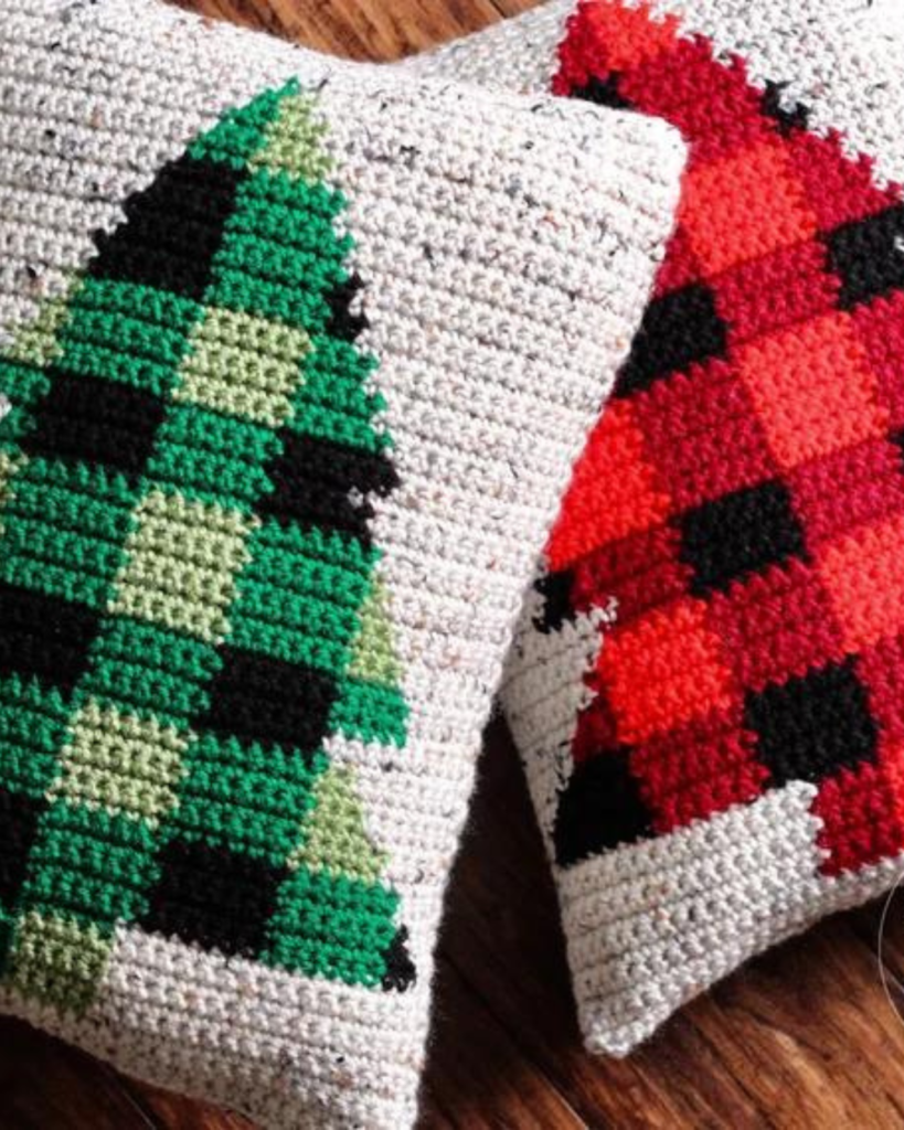 two crochet plaid tree pillows cases, one green and one red