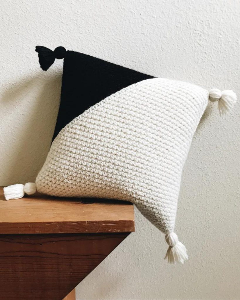 crochet black and white color block pillow with tassels
