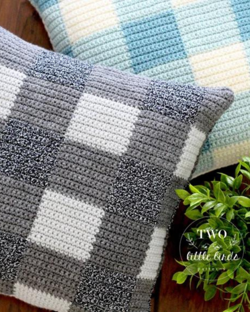 two crochet gingham plaid pillow covers, one grey and white and one blue and white