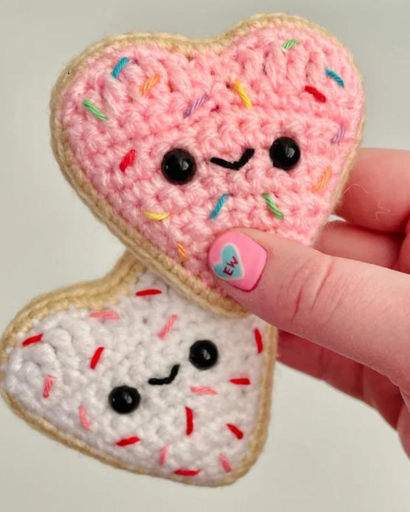 crochet heart shaped amigurumi cookies with faces
