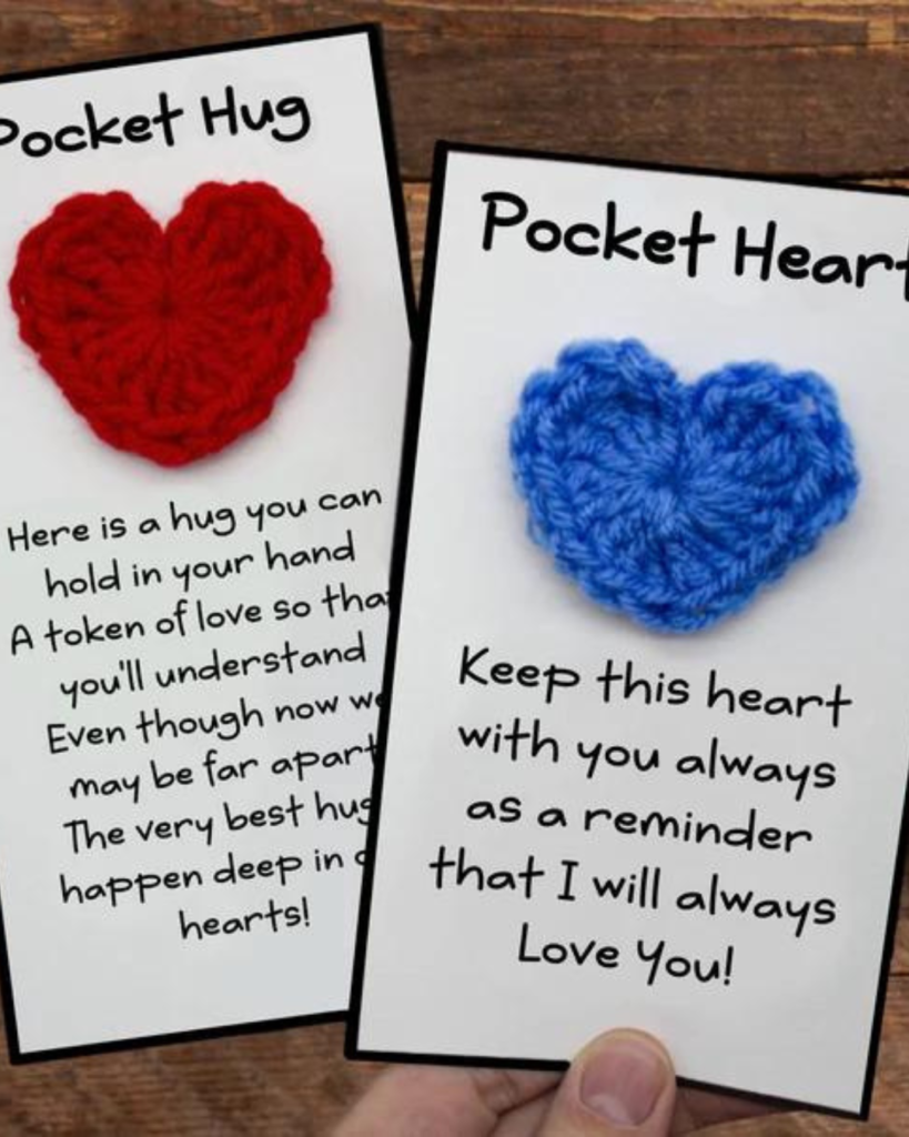 two cards with little crochet hearts attached: one that says "pocket hug" and one that says "pocket heart"