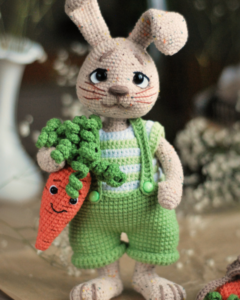 crochet bunny with overalls and a carrot
