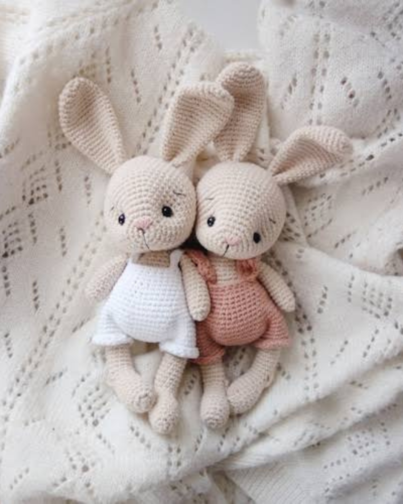 two white crochet amigurumi bunnies