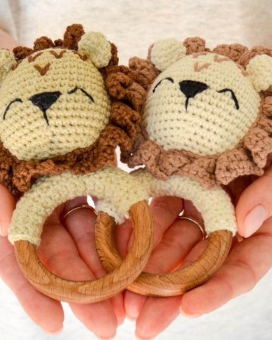 two crochet lion baby rattles