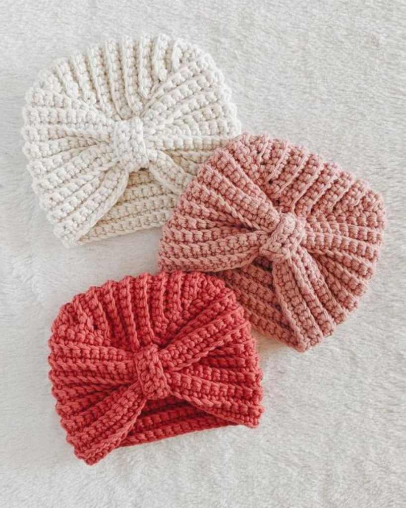three crochet boho baby hats