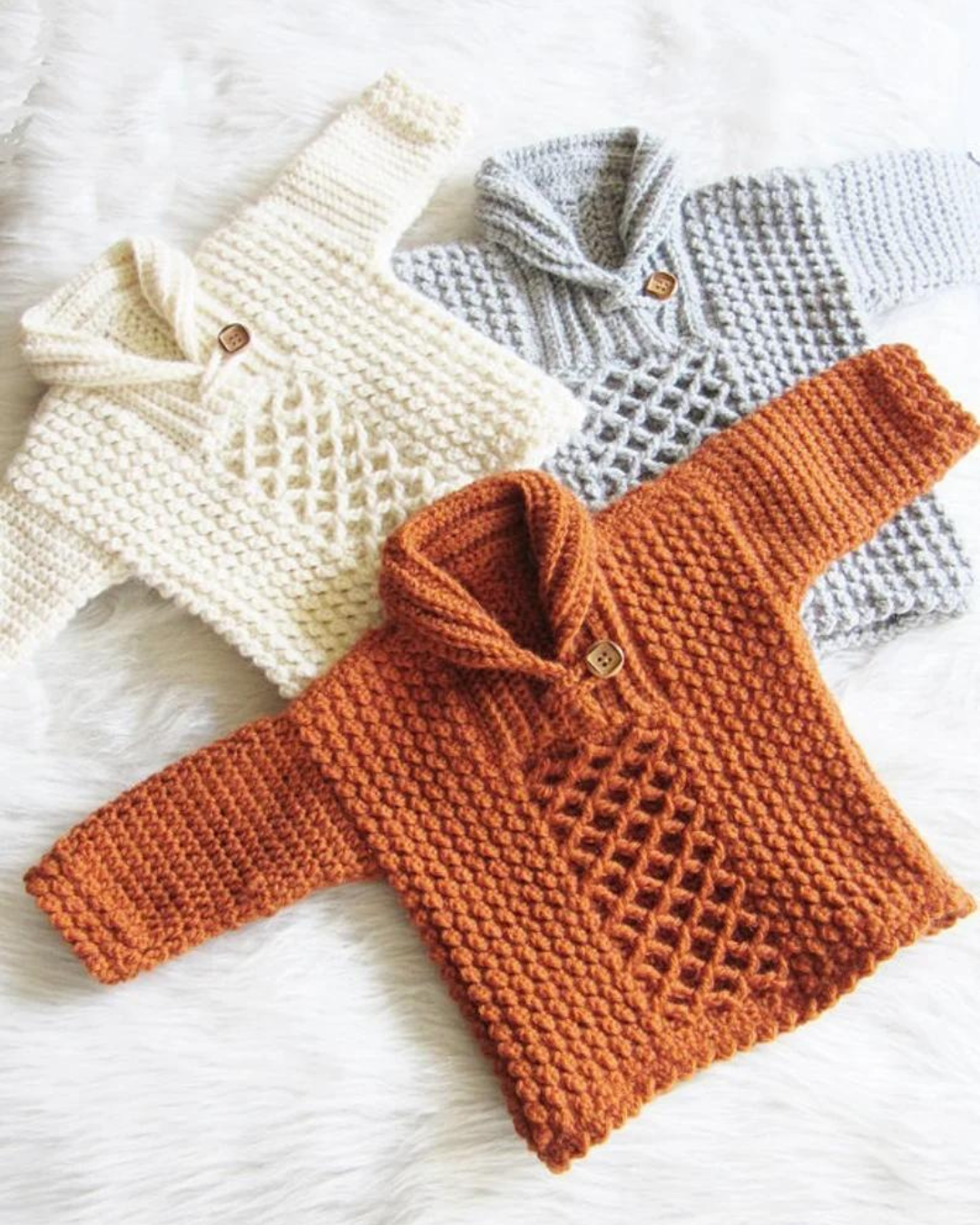 three crochet baby sweater pullovers