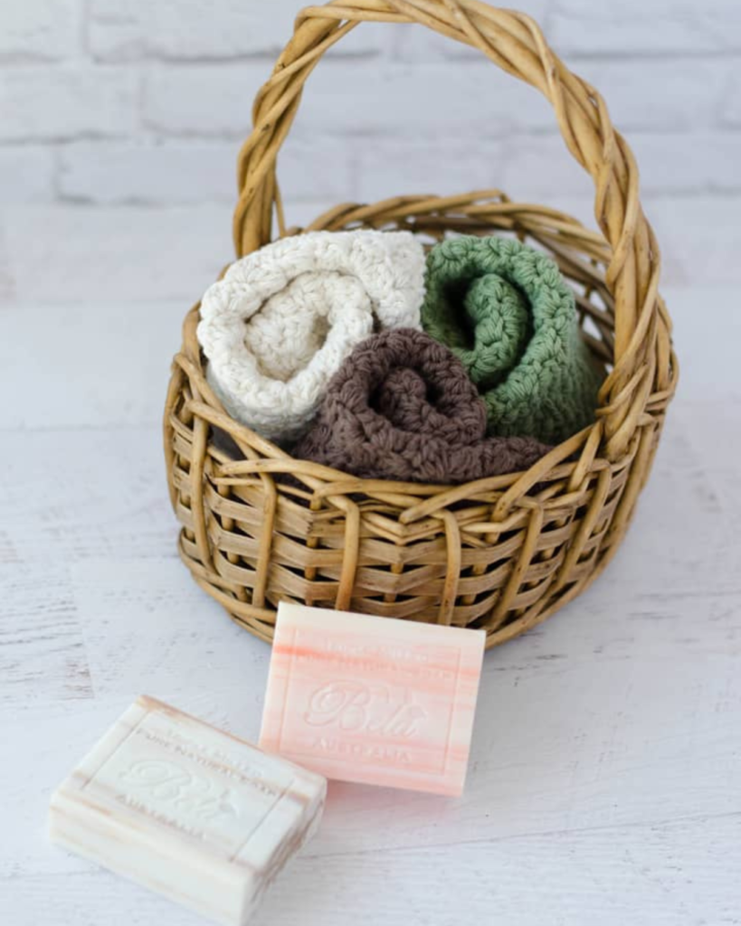 three crochet washcloths in basket with soup bars