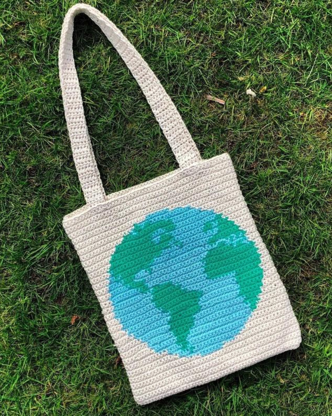 white crochet bag with globe on it