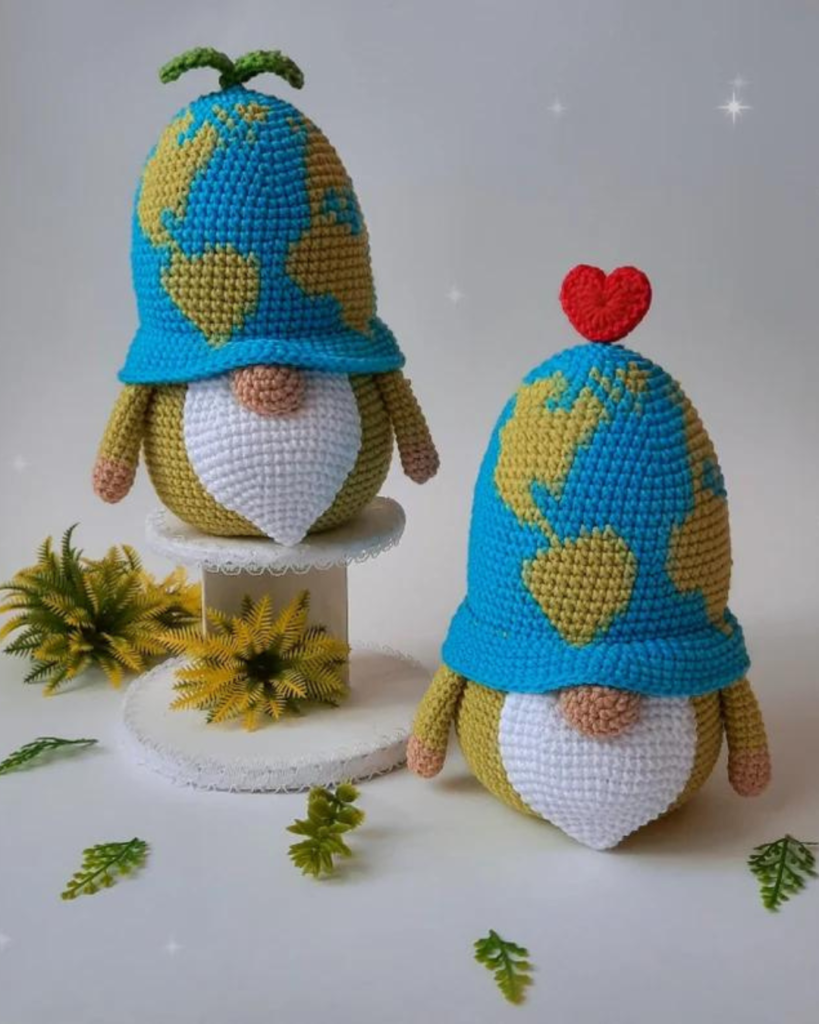 two crochet gnomes with earth hats