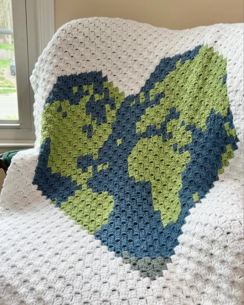 crochet corner to corner blanket with heart-shaped earth