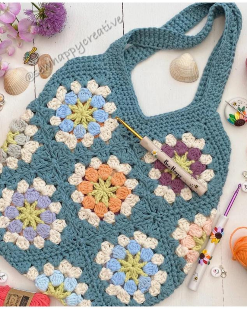 teal blue crochet purse with multicolor granny squares