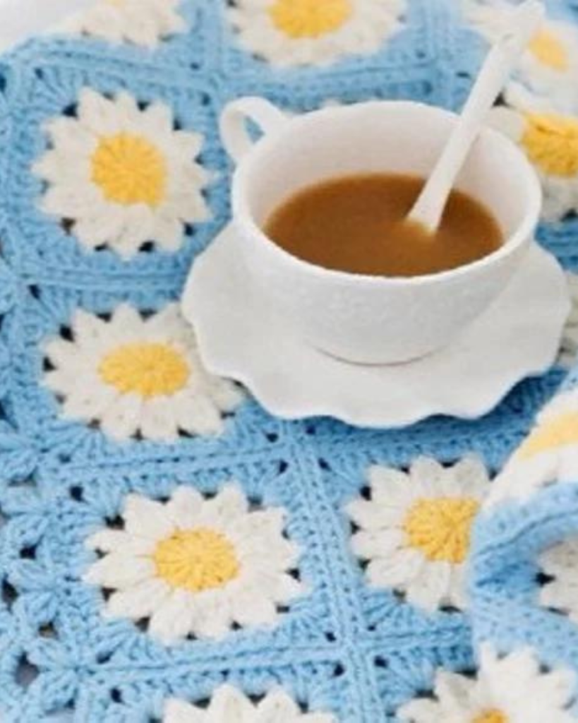 blue, white, and yellow crochet flower granny squares blanket