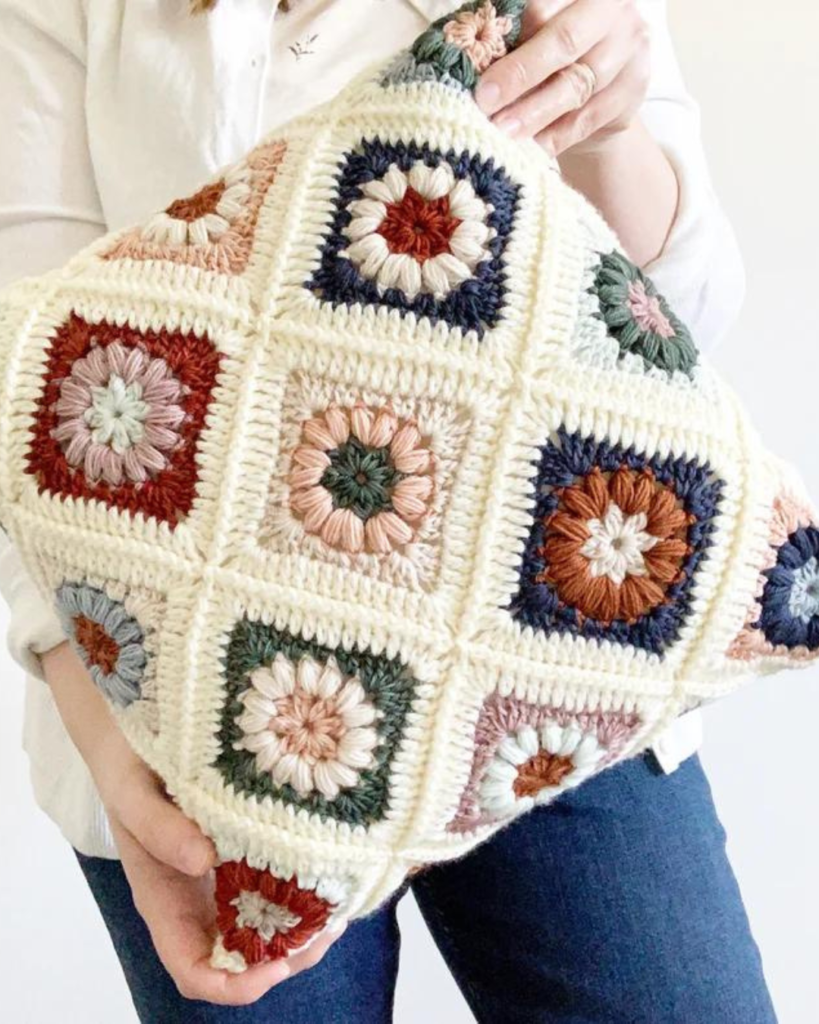 white and multicolor circle granny square pillow case