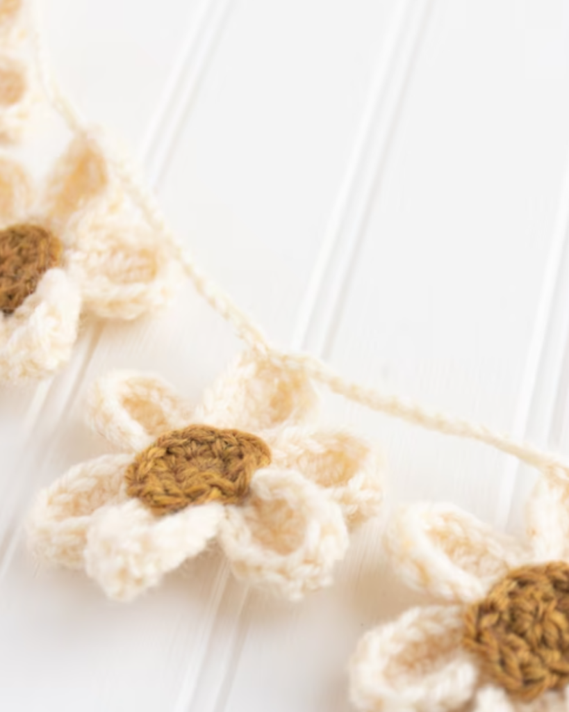 white and brown crochet flower garland
