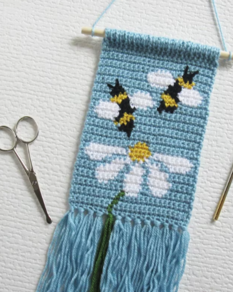 blue crochet bee and flower wall hanging