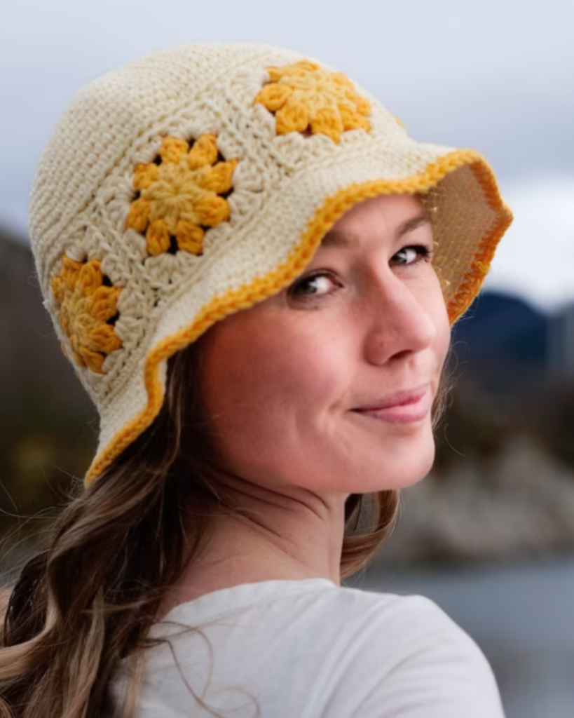 woman wearing white and yellow crochet flower bucket hat