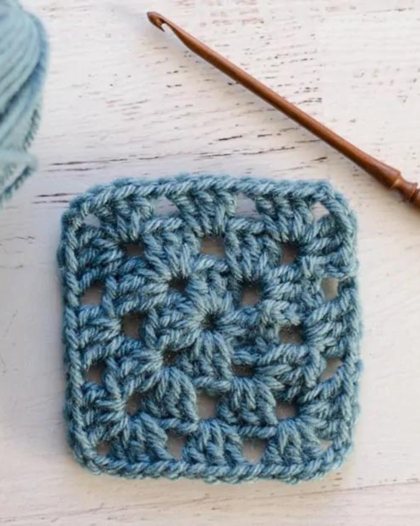blue granny square and hook