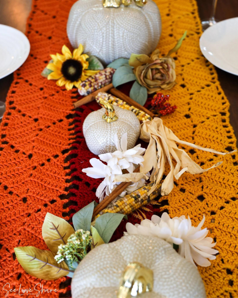 orange, red, and yellow striped crochet table runner