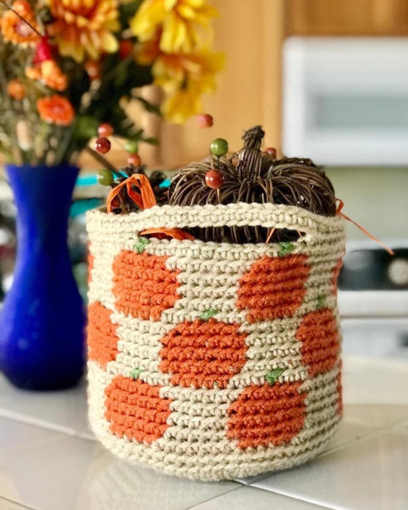 crochet tan basket with pumpkins on it