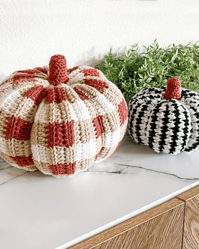 two crochet pumpkins with different colors and patterns
