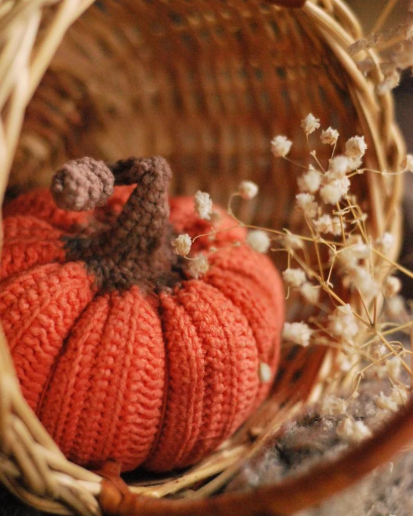 orange crochet pumpkin in basket