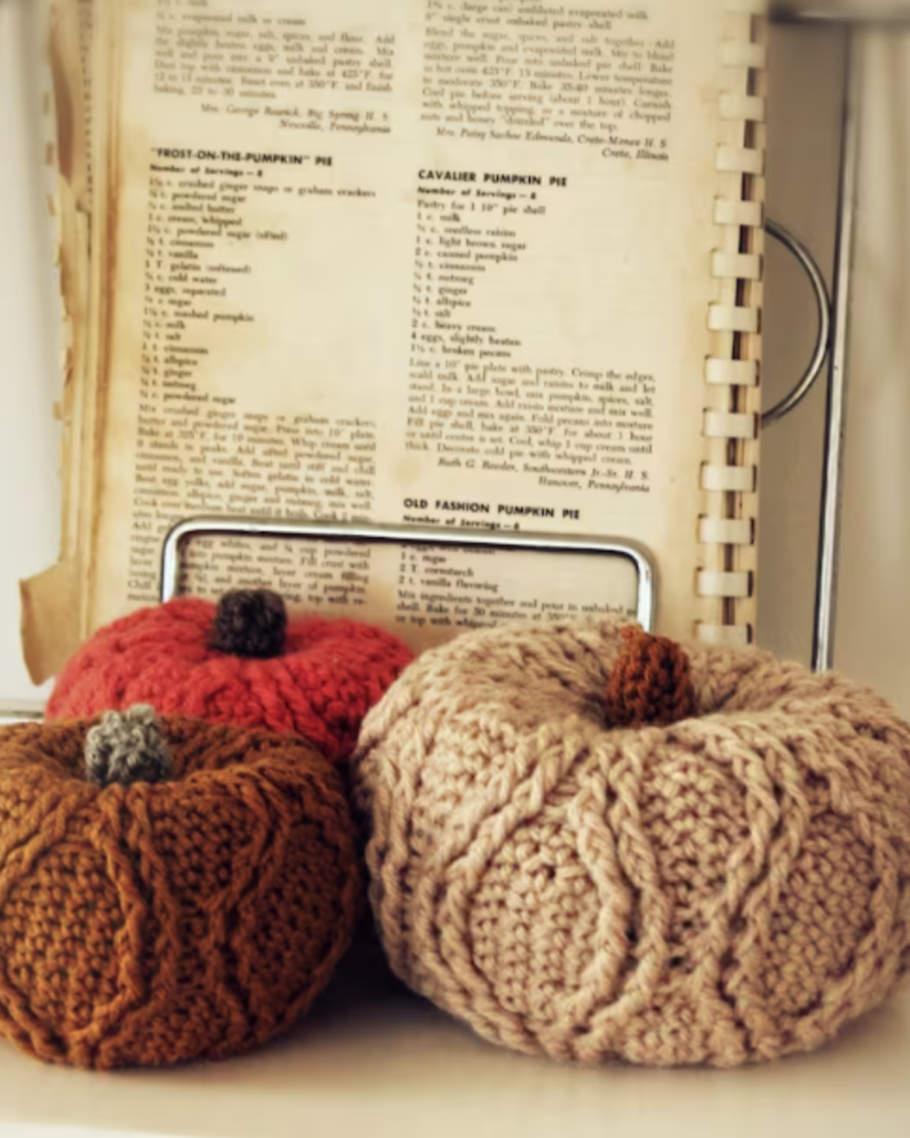 three crochet textured pumpkins of various size and color