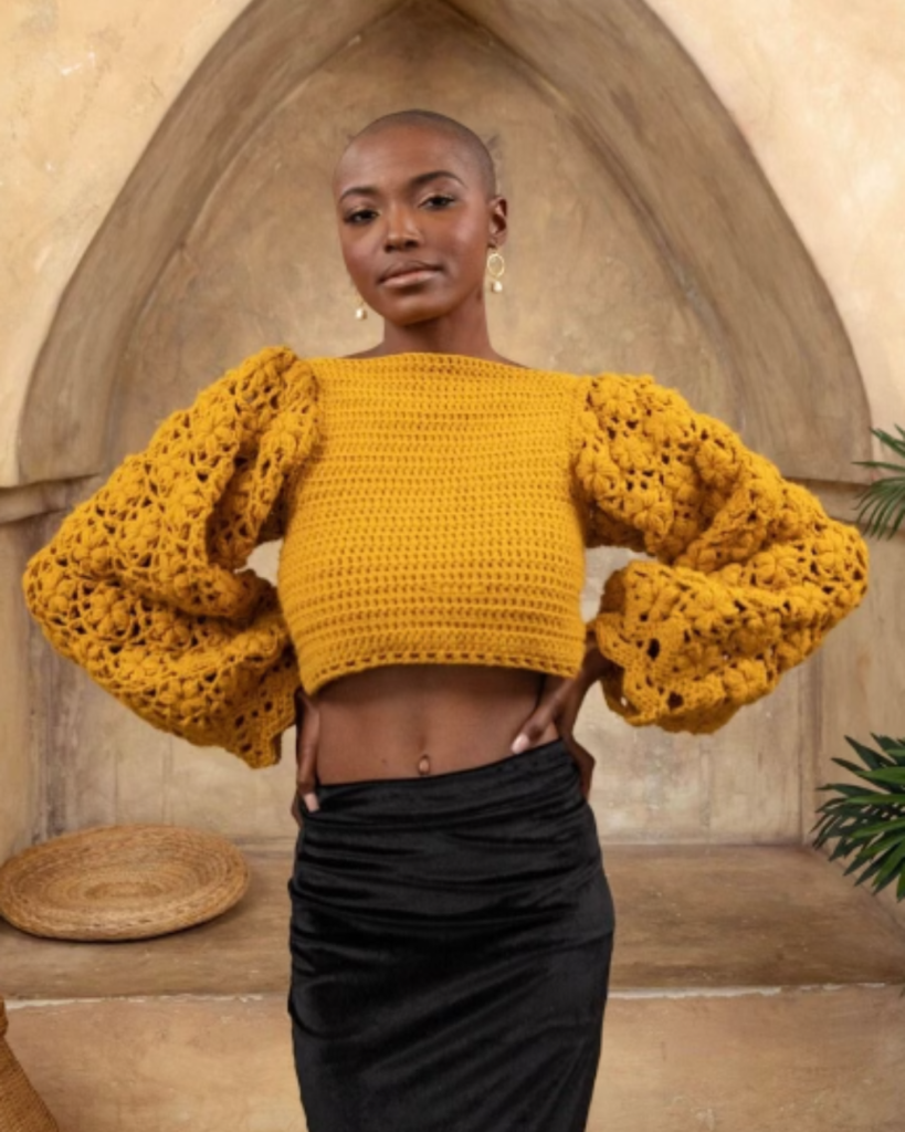 yellow crochet sweater with large puffy sleeves