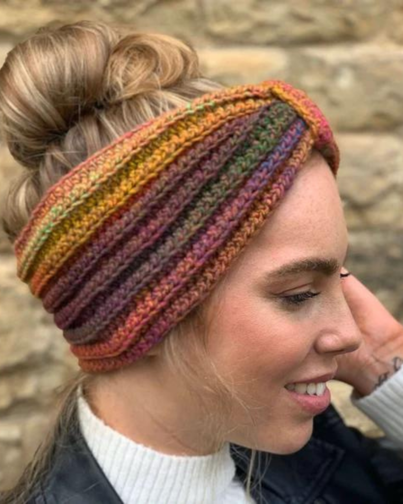 woman wearing multicolor crochet ear warmer