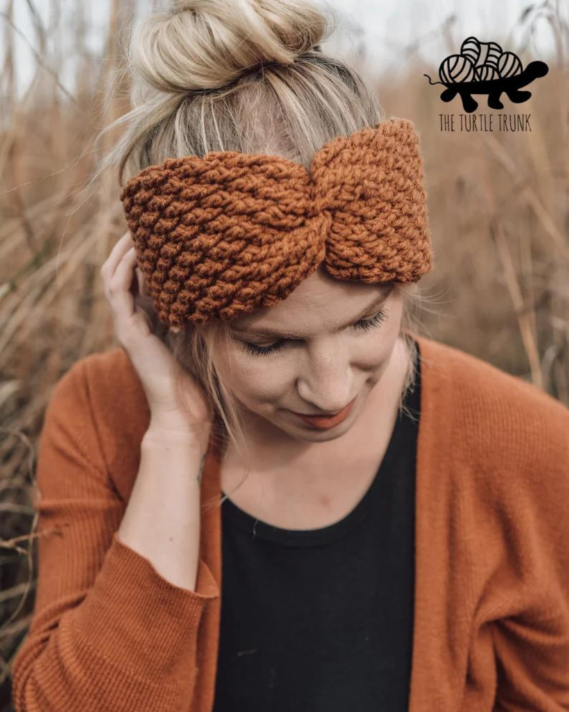 woman wearing alpine stitch crochet ear warmer