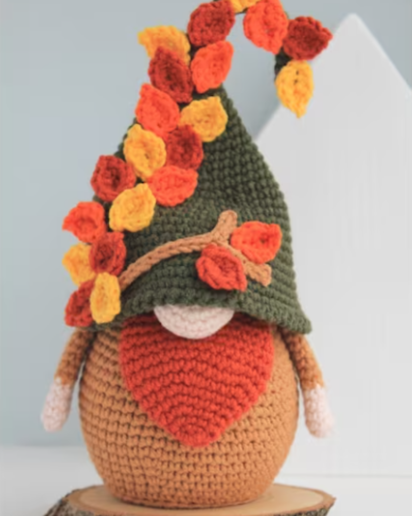 crochet gnome with fall leaves
