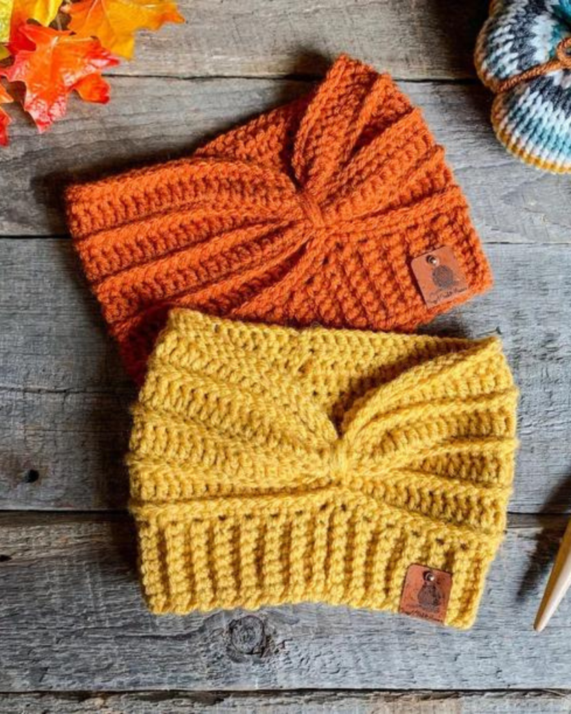 two crochet ear warmers: one orange and one yellow