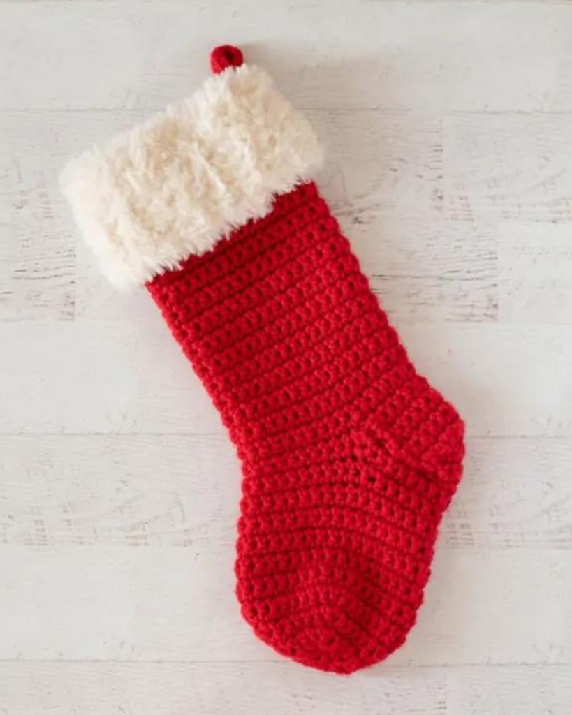 red crochet christmas stocking with white fuzzy top