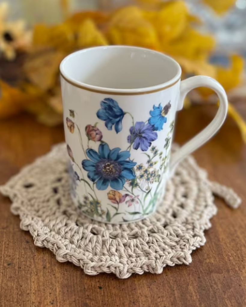 mug on a crochet fall leaf coaster