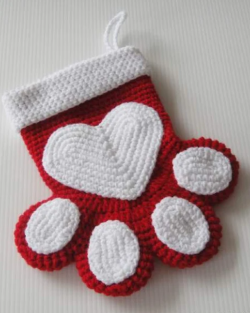 red and white crochet animal paw crochet christmas stocking