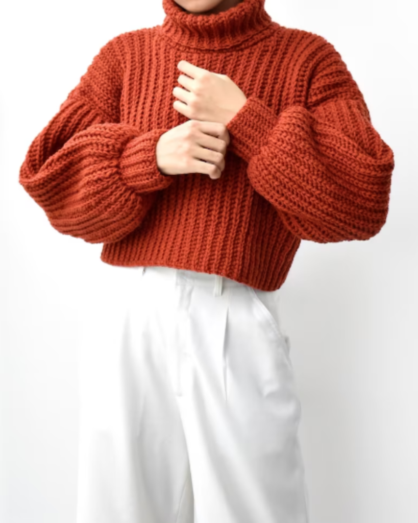 orange cropped turtleneck crochet sweater