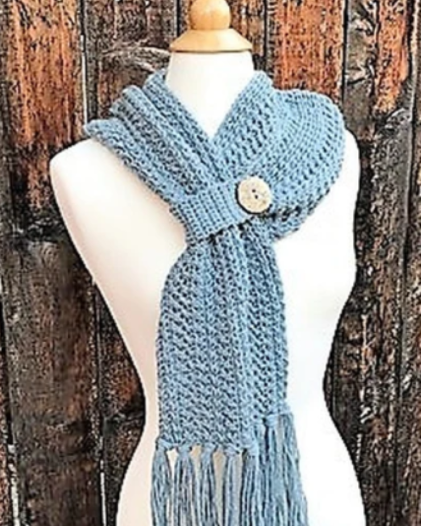 blue crochet scarf with loop and button