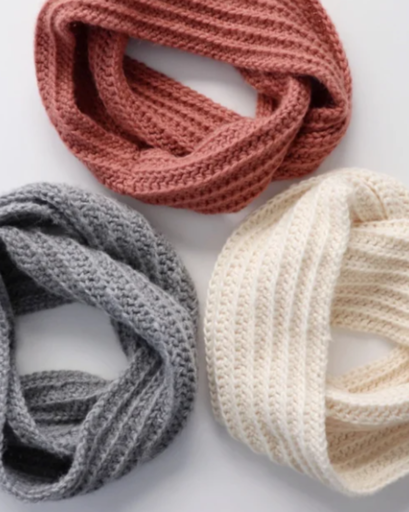 three crochet infinity scarves of various colors