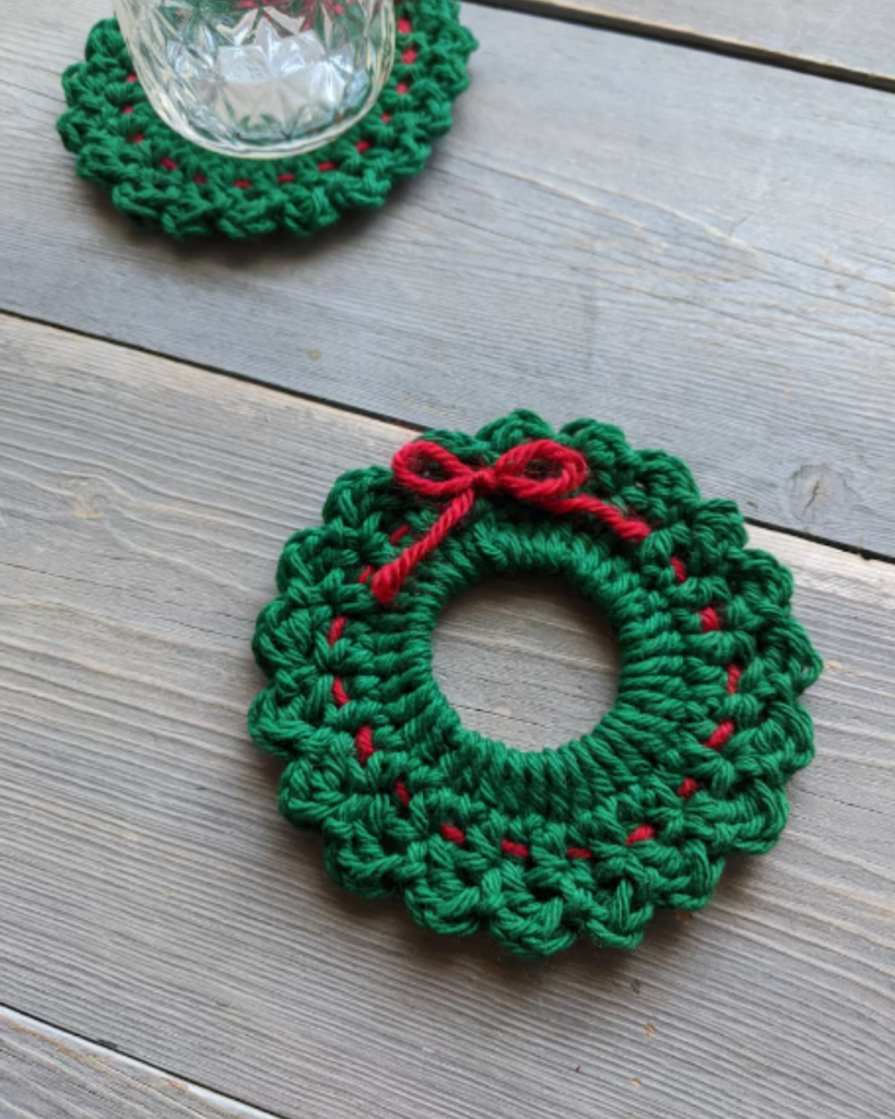 two crochet green crochet wreath coasters