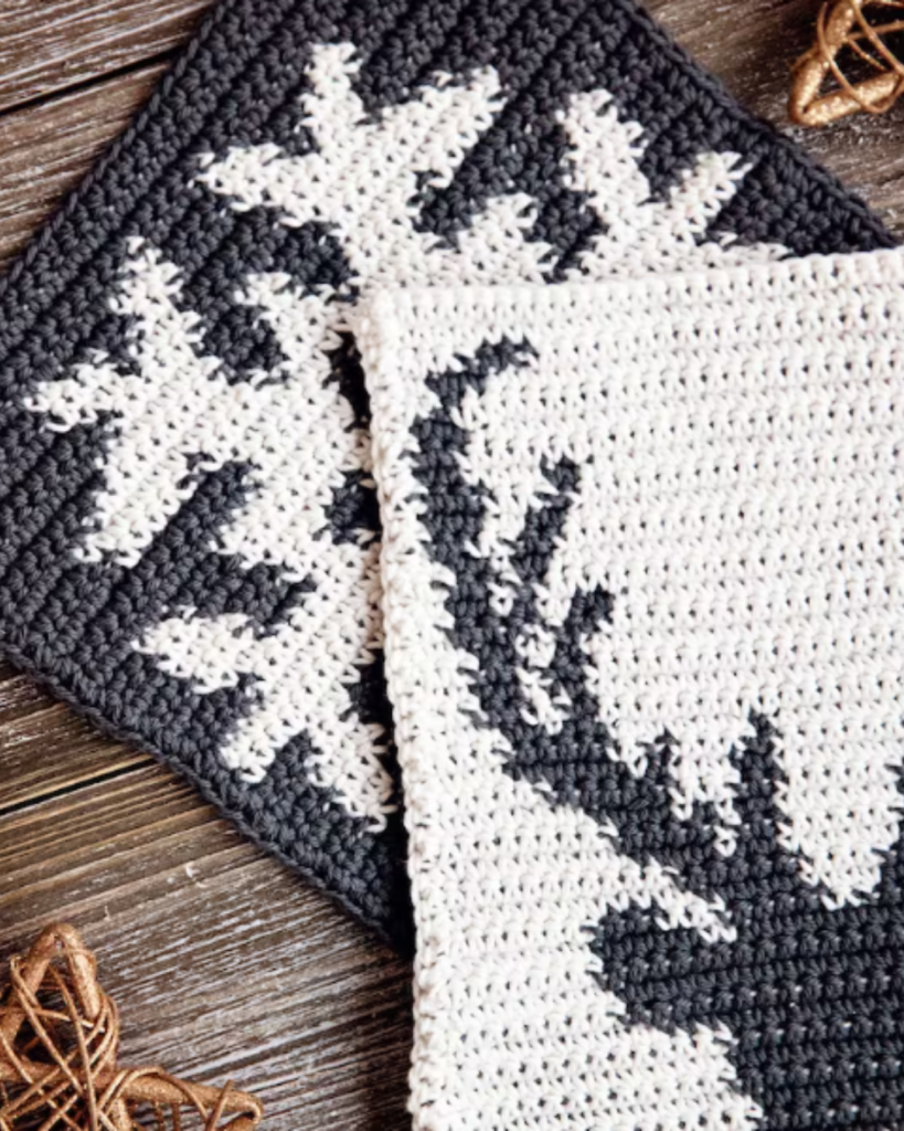 black and white deer and snowflake crochet potholders