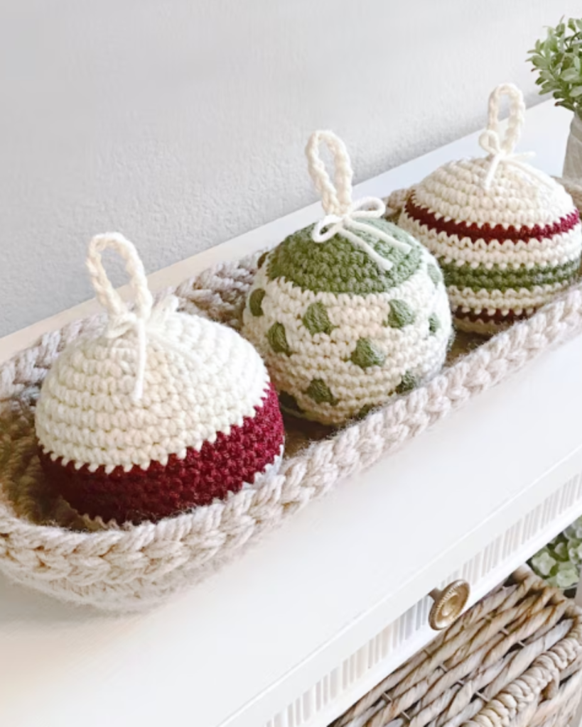 three crochet christmas amigurumi ornaments with various patterns