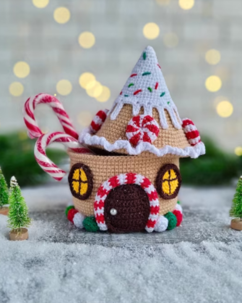 crochet gingerbread house box with candy canes inside