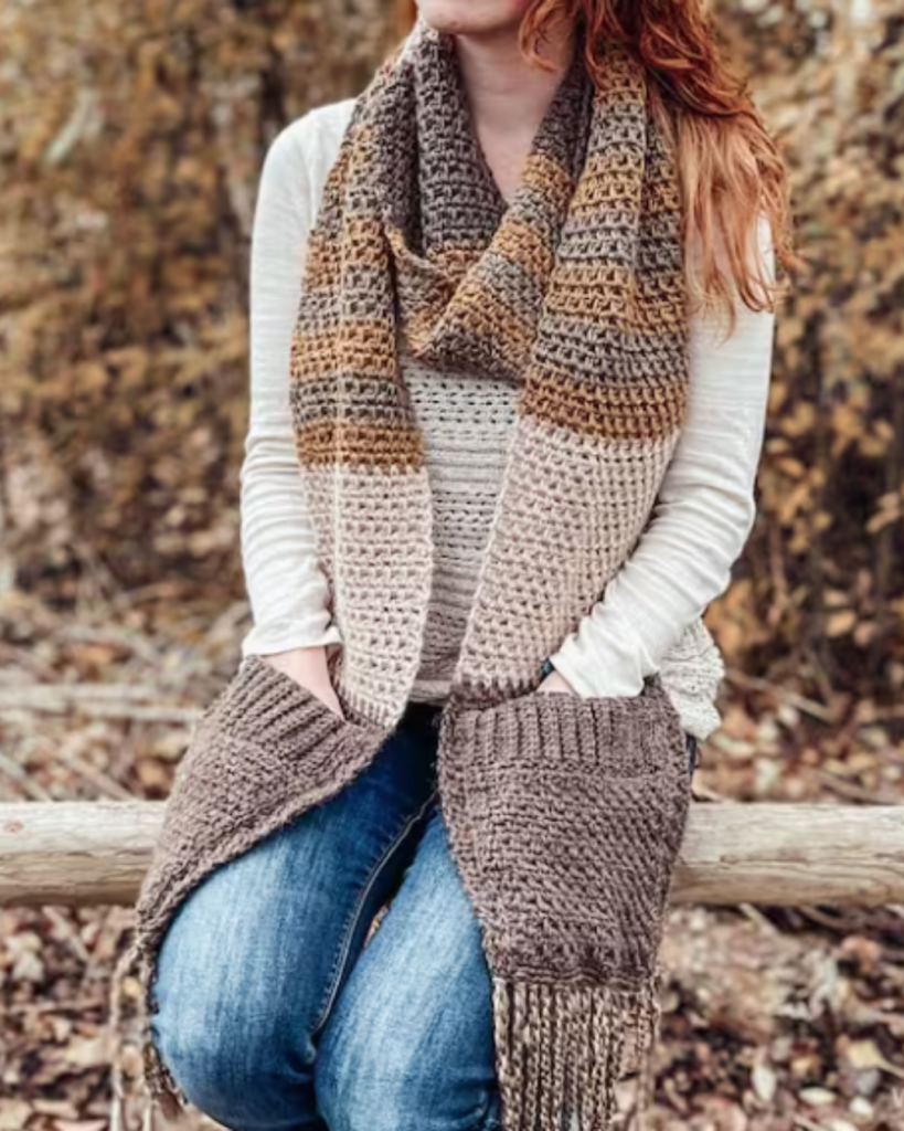 neutral color crochet pocket shawl with tassels