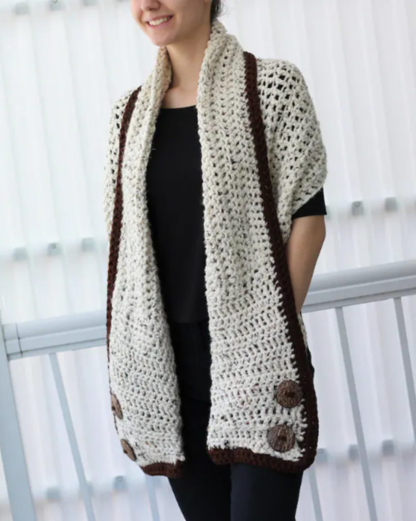 white and brown crochet pocket shawl with buttons